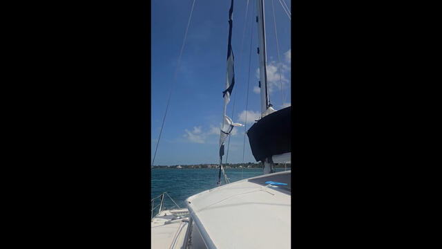 Nassau, Bahamas - repairing our blown-out front sail, dingy engine repair.